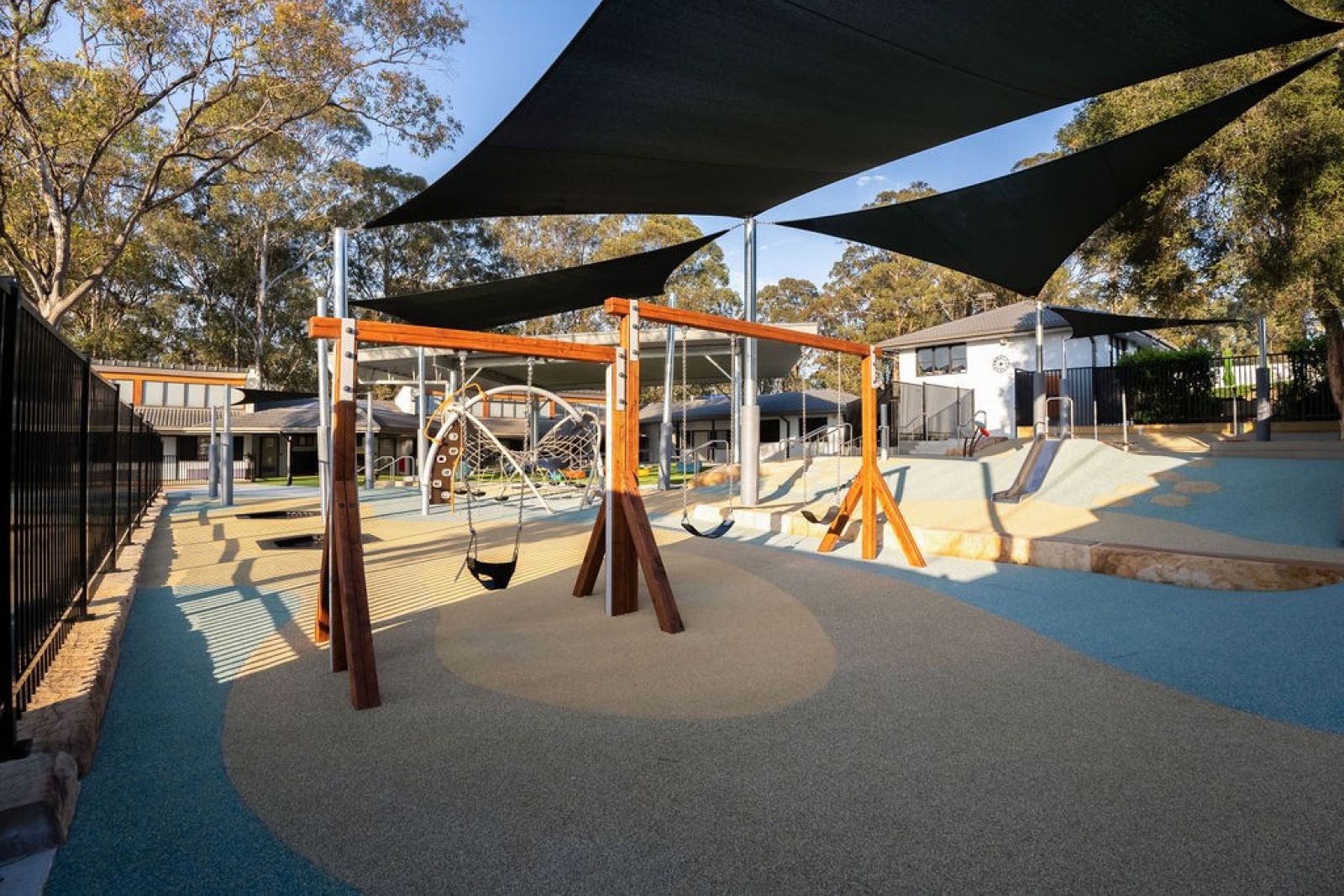 Playground with swings, climbing and shaded areas